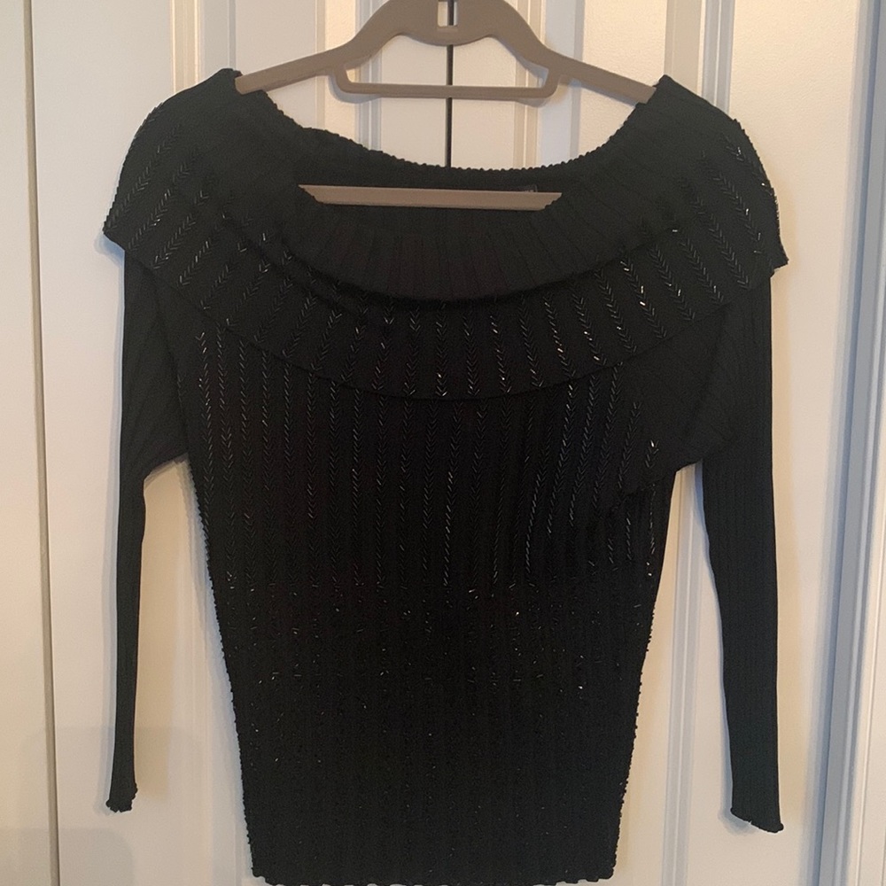 Good quality sweater. Says XL more like M-L.